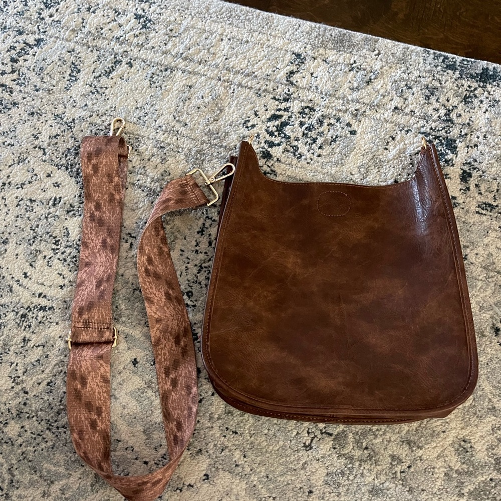 Ah-Dorned vegan crossbody messenger bag! Comes with one strap.